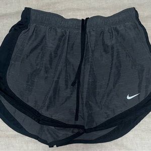 Gray and black Nike running shorts size medium